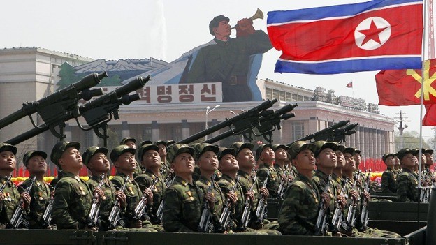 North Korean Leader Takes the Salute as His Army Fires Rockets and ...